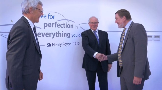 The prize winners shake hands