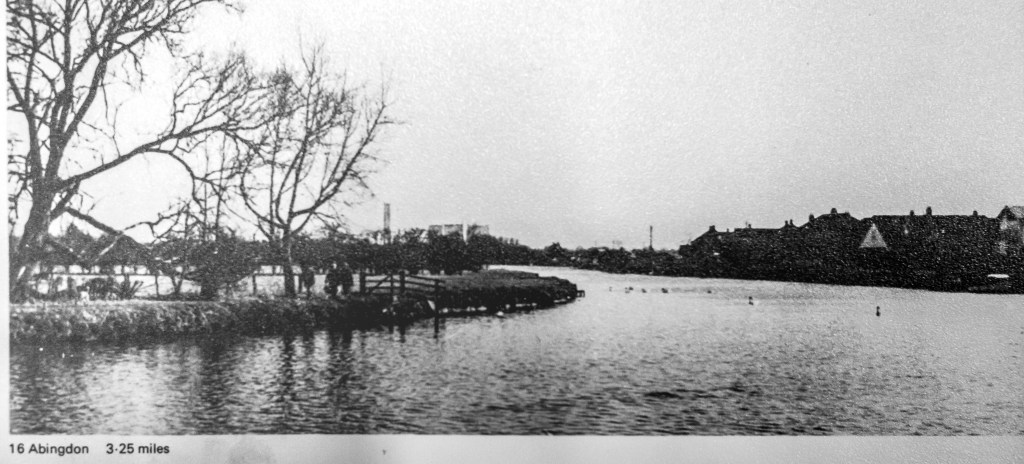 Black and white photo of the River Thames with cooling towers drawn on in the distance