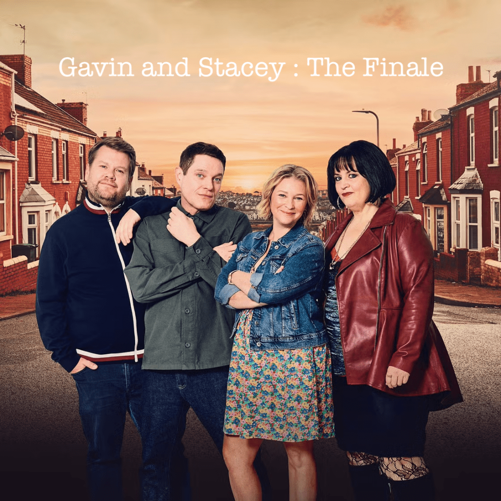 Four main characters, left to right Smithie, Gavin, Stacey, Nessa, pose in a group at the top of a street of terraced houses in Barry Island